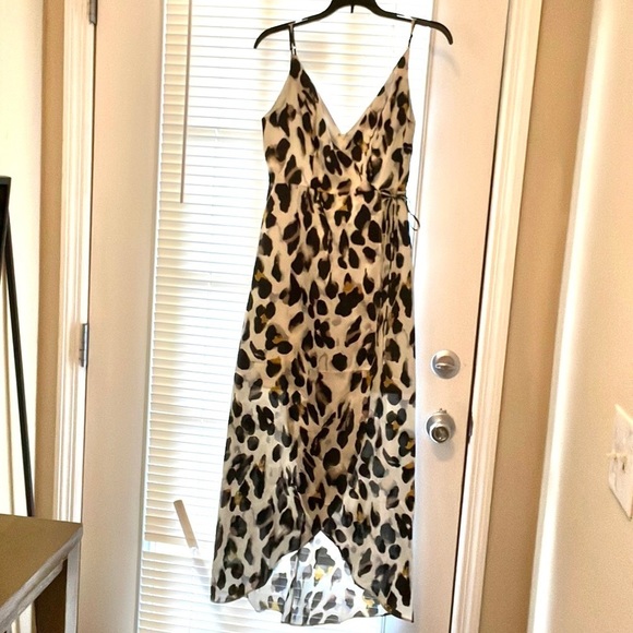essue Dresses & Skirts - Essue faux wrap high low midi animal print dress S
